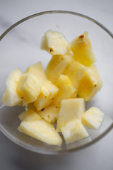 Pineapple in the bowl on marble background