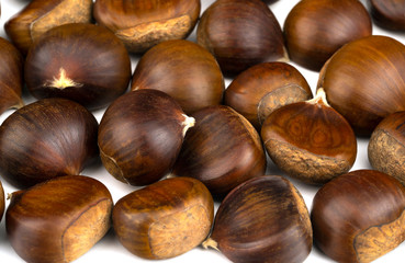 Chestnuts with shell isolated on white background, a pile of fresh chestnuts