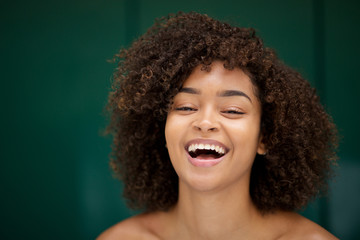 Close up portrait of beautiful young african american woman laughing