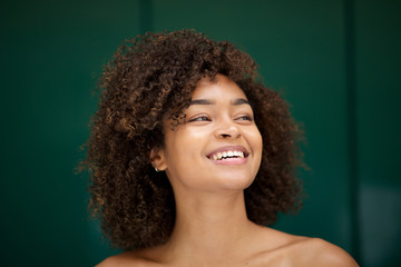 Close up beautiful young african american woman smiling and looking away