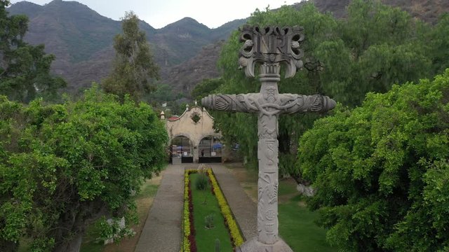 Aerial drone view of an antique stone cross in Malinalco, Mexico