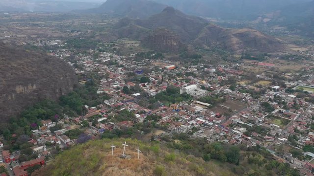 Amazing aerial drone view of the colonial town of Malinalco from the Hill of the Three Crosses, Mexico