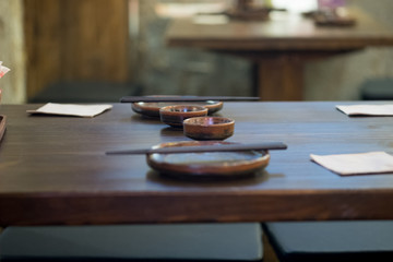 Fototapeta na wymiar Set of empty dish on table in asian restaurant.