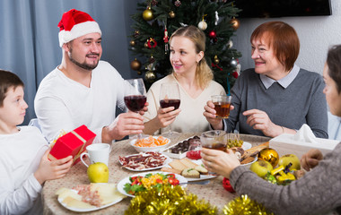 Family at dining table for Christmas dinner