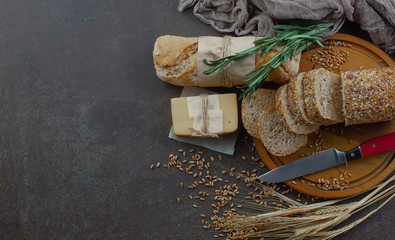 Bread in a composition with kitchen accessories on an old background
