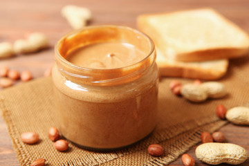Fototapeta na wymiar creamy peanut butter on the table. Peanut paste.