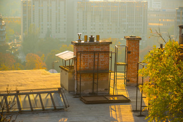 Old apartment buildings downtown at shiny sunset