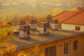 Old apartment buildings downtown at shiny sunset