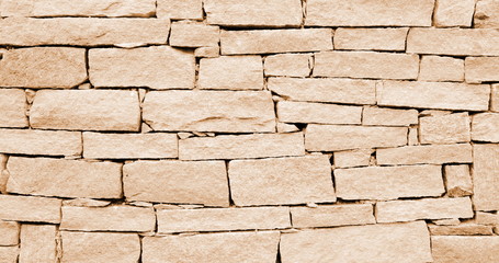Fototapeta premium Hintergrund Mauer abstrakt Steinmauer beige braun