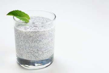 Chia pudding with mint on a white background. Space for text or design.