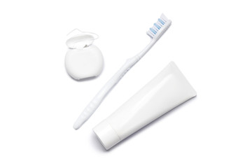 toothbrushes, toothpaste, dental floss on white background. Dental care