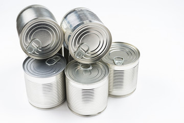 Group of silver canned food on white background.