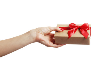 Gift box in a female hand on white