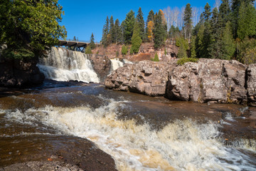 Stunning fall color scenery at Gooseberry Falls State Park, at the lower waterfall