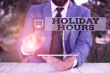 Conceptual hand writing showing Holiday Hours. Concept meaning employee receives twice their normal...