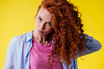 hair loss treatment prevention concept. luxury volume curly redhead ginger young woman proud her...