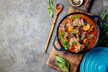 Beef ribs Bourguignon. Beef ribs stewed with carrot, onion in red wine. France dish. Top view