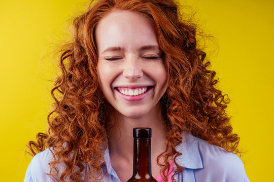 Redhaired Ginger Woman Holding Non Alcoholic Alcohol Wine Bottle And Feeling Good Emotions