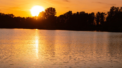 Beautiful sunset with reflections near Plattling, Isar, Bavaria, Germany