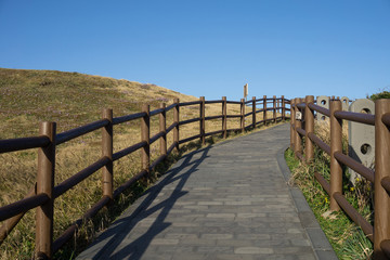 Fototapeta na wymiar The path way on Seongsan Ilchulbong Peak or sunrise peak, Jeju, South Korea