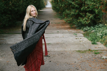 young beautiful pregnant woman in a red dress