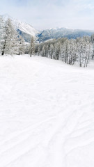 snow-covered mountain slope and mountains