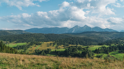 Obraz premium Landscape with mountains and clouds.