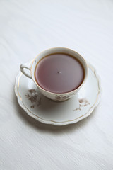 White porcelain tea cup on a white background