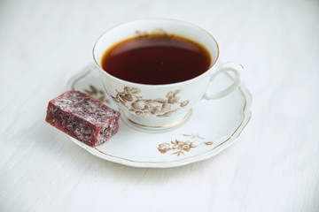 White porcelain tea cup on a white background