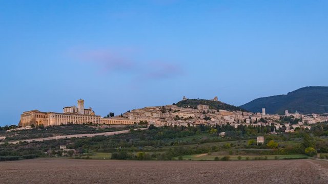 Panoramic landscape timelapse. Assisi Italy Basilica of St. Francis  sunset to night. Sunset amazing view.