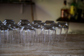 clean inverted glasses on the table