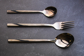 cutlery rustic, used for eating or serving food(spoons, fork, shiny and beautiful). food...
