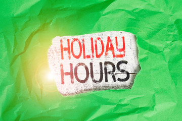 Conceptual hand writing showing Holiday Hours. Concept meaning employee receives twice their normal...