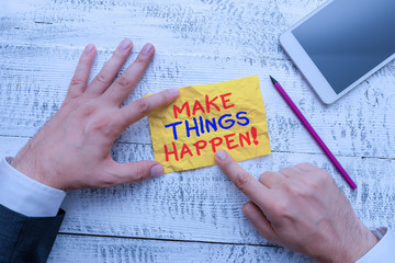 Word writing text Make Things Happen. Business photo showcasing you will have to make hard efforts in order to achieve it Hand hold note paper near writing equipment and modern smartphone device
