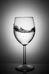 Glass with water up and splash