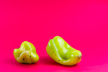 ugly food. green pepper on a red background