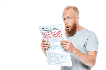 shocked bearded man reading newspaper with fake news, isolated on white