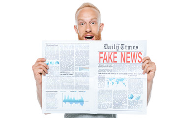 Fototapeta na wymiar excited man reading newspaper with fake news, isolated on white