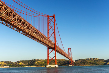 Red bridge, Lisbon, Portugal. Ponte 25 de Abril Suspension Bridge over the Tagus river.