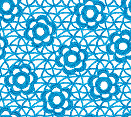 Seamless Irish lace pattern. Crochet. Blue yarn. Knitted flowers on a mesh of air loops.