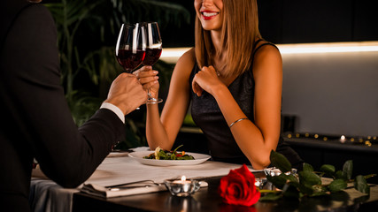 Romantic couple having intimate dinner for two at home kitchen