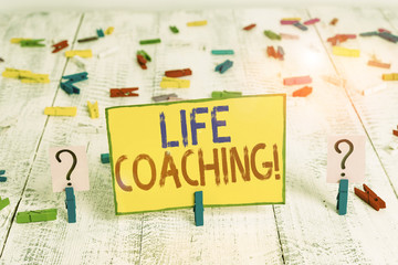 Text sign showing Life Coaching. Business photo text demonstrating employed to help showing attain their goals in career Scribbled and crumbling sheet with paper clips placed on the wooden table