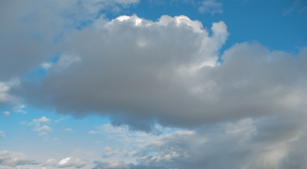 Cumulus clouds over the earth in late autumn