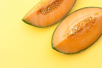 ripe melon on yellow background