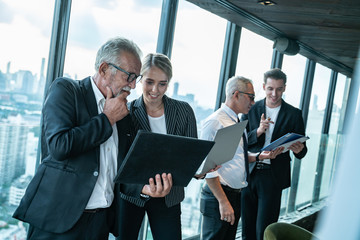 Meeting and discussion concept.business people communicating in office.Mature businessman discuss...