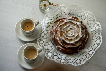 cup of coffee and cake on table
