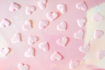 Beautiful silk pink hearts on a holographic pink background. Holiday concept Valentine Day. Plase for text . Flat lay.