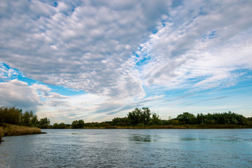 Beautiful Stratocumulus clouds in the Netherlands at the river the IJssel nearby the city Deventer