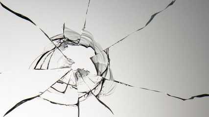 glass crack hole from a ball on a white background