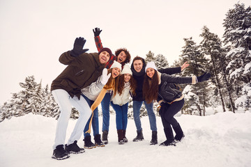 Fototapeta na wymiar People having fun on the snow in nature in winter